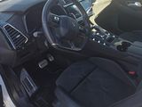the interior of a car with a steering wheel and dashboard