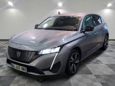 the new peugeot car is parked on a checkered floor