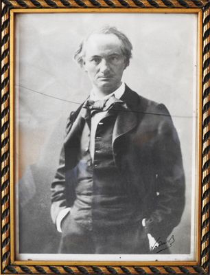 an old photo of a man in a suit and bow tie