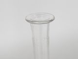 a clear glass vase sitting on a white surface