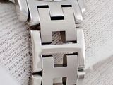 a close up of a watch on a person ' s wrist