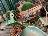a green wheelbarrow and a green wheelbarrow and a green wheelbarrow and a green wheelbarrow and a green wheelbarrow