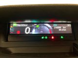 the dashboard of a car with a digital display on it