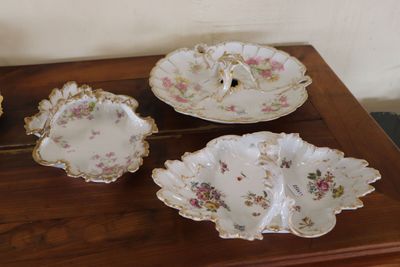 a table with a bunch of plates and bowls on it