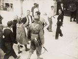 a group of people that are standing around in the street