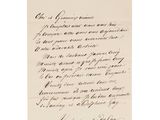 une lettre écrite en cursive sur un bout de papier
