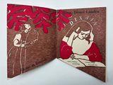 an open book with a picture of a man and a woman on it