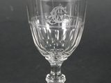 a close up of a wine glass on a table