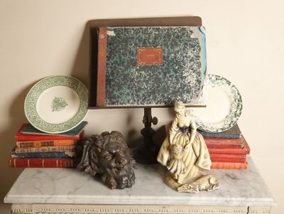 a statue of a dog sitting on top of a table