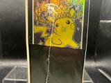 a close up of a picture of a pokemon card on a display case
