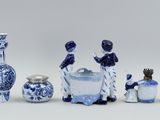 a group of blue and white vases and vases on a table