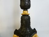 a black and gold table with a clock on it