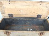 an old wooden trunk with a metal latch on it