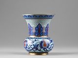 a blue and white vase sitting on a table
