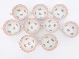 six cups and saucers with floral designs on them on a white surface
