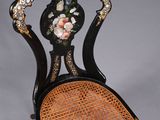 an image of a chair with a floral design on the back of it