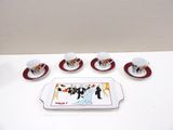 five cups and saucers sitting on a tray on a table