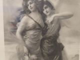 an old picture of two women standing next to each other