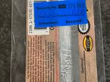 a plastic package with a knife inside of it on a table