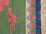 an image of a colorful rug with a horse on it