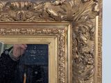 a man taking a picture of himself in a mirror