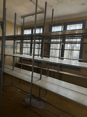 a room with a lot of tables and benches in it