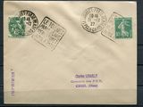 an old envelope with stamps on it sitting on a wooden surface