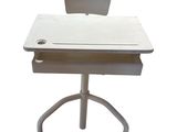 a white desk with a chair on top of it