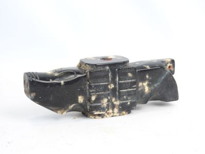 a small black object that is sitting on a white surface