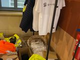 a pile of clothes and other items in a room