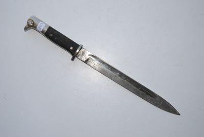 a knife that is laying on top of a table