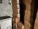 boxes stacked on top of each other in a room next to a wall