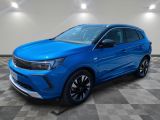 a blue 2020 kia korox is shown in a showroom