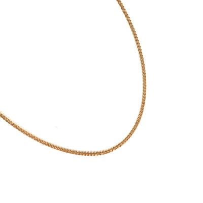 a close up of a gold chain on a white background