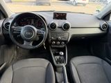 the interior of a car with a steering wheel and dashboard controls