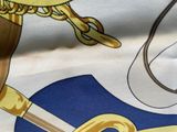 a picture of a close up of a fabric with a coat of arms and a sword