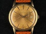 an image of a wrist watch with a brown leather band