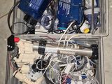 a box full of wires and other electronics on the floor
