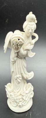 statue of a woman holding a baby in her arms