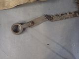 an old pair of scissors on the floor next to a bag