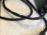 a green and black welding machine on a white table
