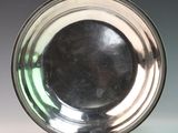 a silver plate that is sitting on a table