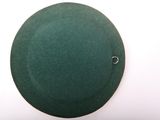 a green hat on a white surface with a single button