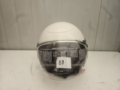 a helmet on a table with a price tag on it
