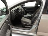 the interior of a car with the door open and the driver ' s seat down