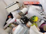 a white bag full of assorted items in it