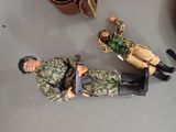 two figurines of soldiers on a table next to each other