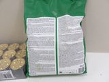 a bag of gold coins sitting on a counter next to a bag of gold coins