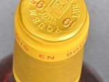 a close up of a bottle of liquor on a table