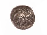 an image of a silver coin with a dragon on it